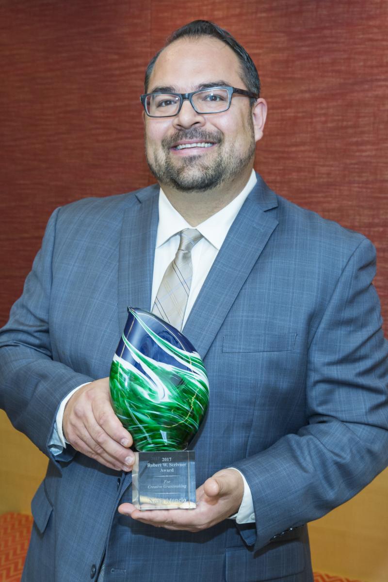 Noah Atencio accepting the Scrivner Award